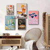 A collection of four wall art prints featuring food and wine themes, including citrus fruit, cocktails, and gourmet dishes.