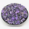 A pile of purple amethyst gemstone chips for crafts and jewelry making.