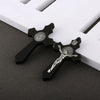 A set of black wooden crucifix pendants featuring embossed religious symbols.