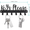 Black wall-mounted metal key holder with hooks featuring a decorative sign and multiple key rings.