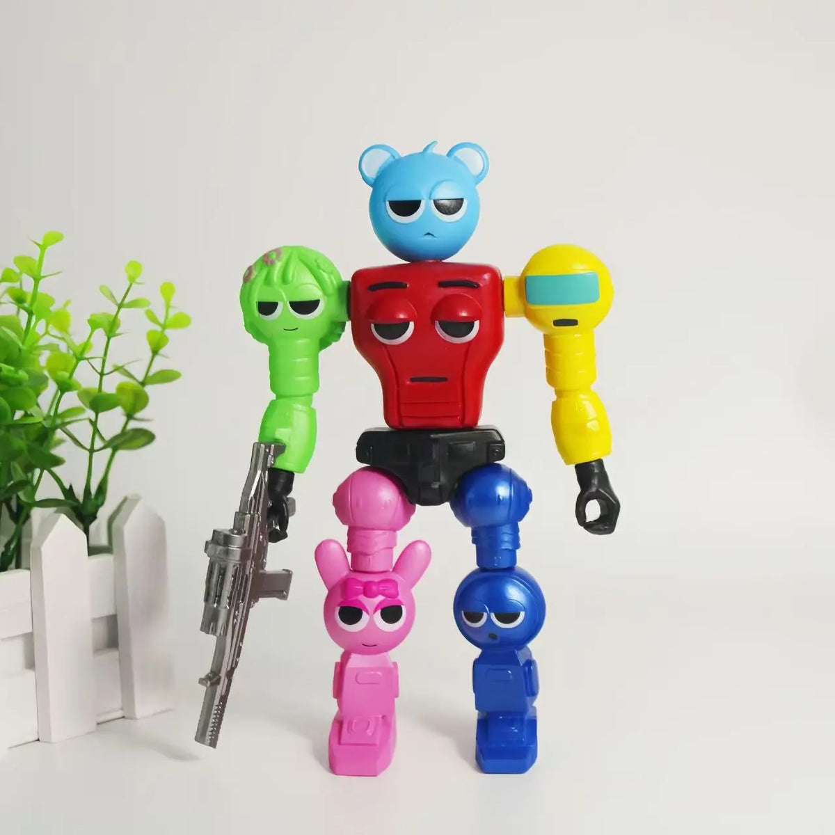A colorful robot joint mobile assembly worker game doll with multiple colored limbs and accessories.
