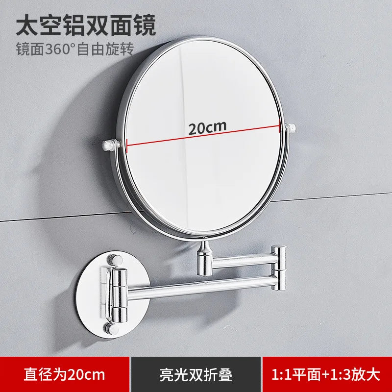 A round folding double-sided wall mirror with a 20cm diameter and telescopic arms mounted on a gray wall.