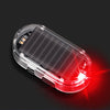 A clear plastic device with a red LED light is shown against a dark background.