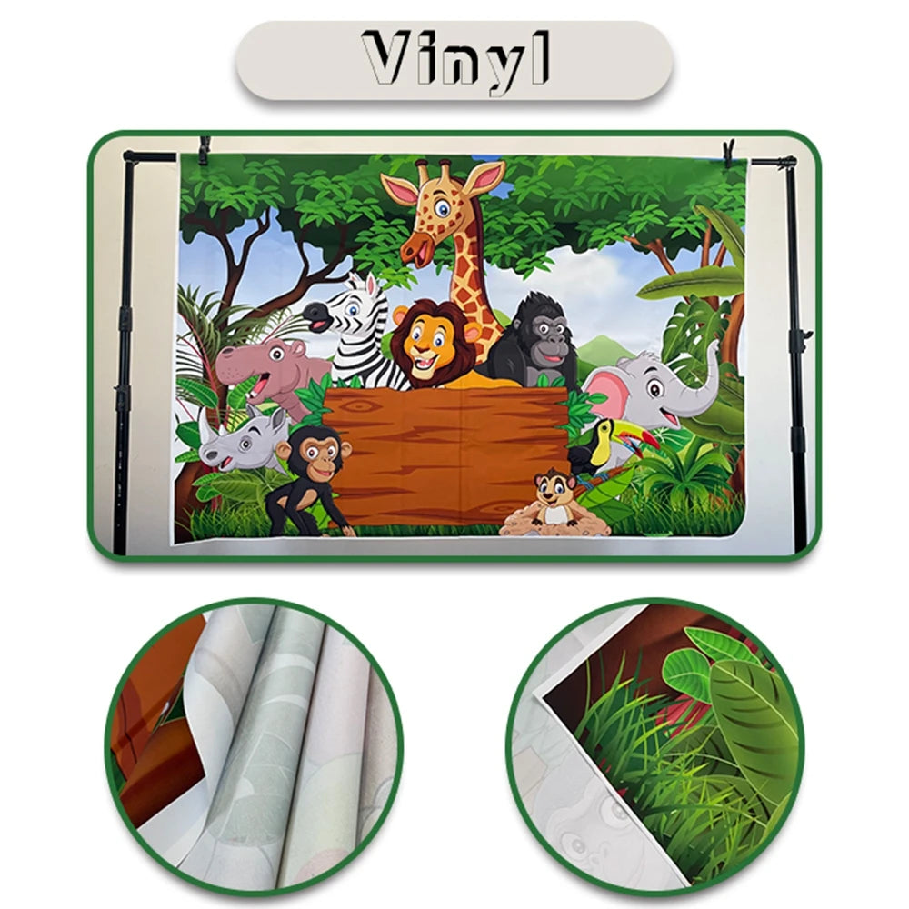 A vinyl photo backdrop featuring jungle animals like a giraffe, monkey, and elephant against a green background.