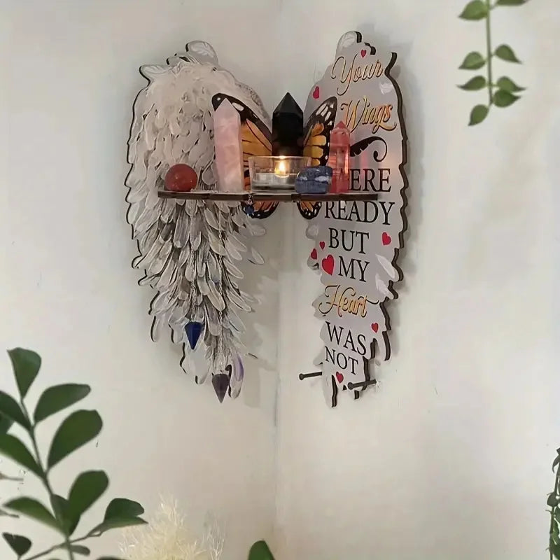 A boho wood angel wing wall shelf featuring crystal display holders and a heart message sign.