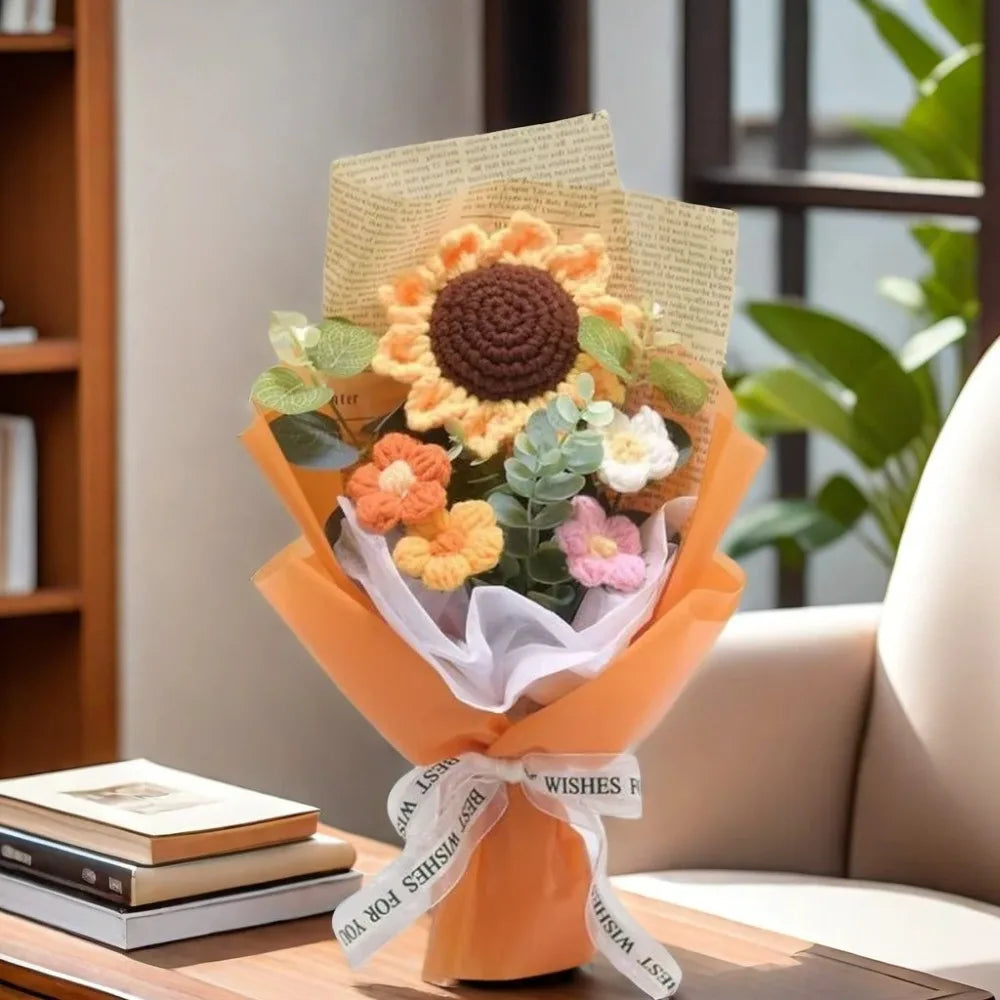A bouquet of handcrafted crochet sunflowers and daisies wrapped in orange paper
