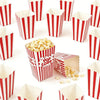 Red and white striped paper boxes filled with popcorn and snacks
