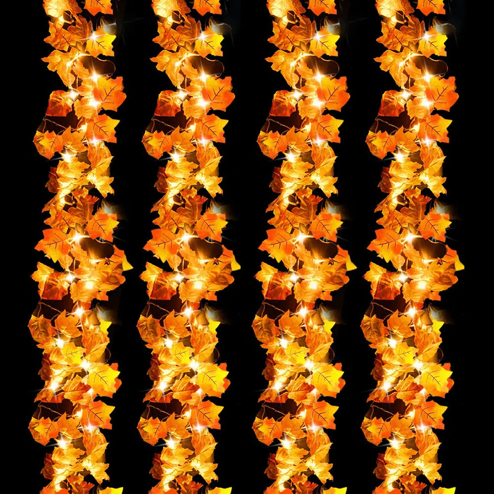 A close-up of an orange and yellow LED string lights garland with leaf-shaped bulbs.