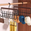 Wall-mounted metal coat rack with storage box and eight hooks displaying various colored hats and bags