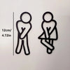 Deux panneaux de porte silhouettes noires montrant une figure debout et une figure assise, avec une échelle indiquant 12 cm o