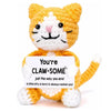 Handcrafted crochet orange and white cat doll with a positive message card