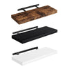 A set of three floating wall shelves made of wood in rustic brown, black, and white finishes with metal brackets.