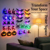 A wall display of 30 Halloween-themed LED stickers featuring bats, spiders, and jack-o'-lanterns.