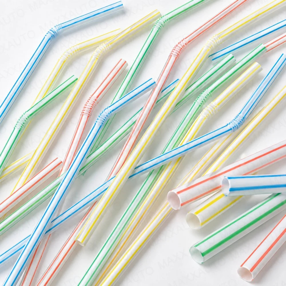 Assorted flexible reusable drinking straws in various colors like blue, green, yellow, and red.