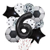 A collection of black, white, and silver football-shaped helium foil balloons for birthday party decorations.