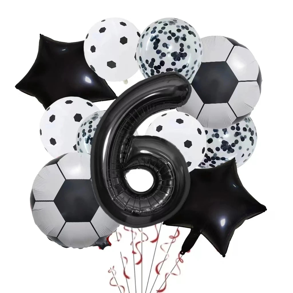 A collection of black, white, and silver football-shaped helium foil balloons for birthday party decorations.