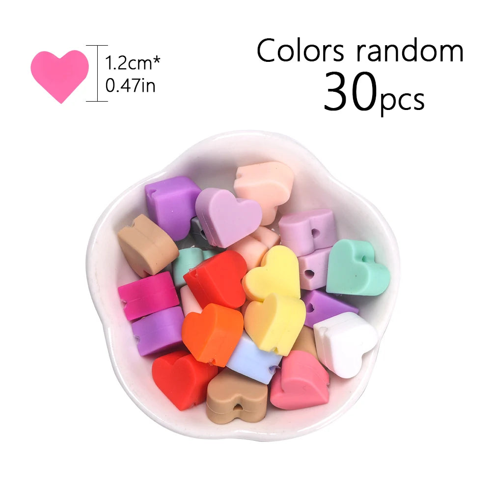 A bowl filled with 30 assorted silicone heart beads in various colors for DIY jewelry making