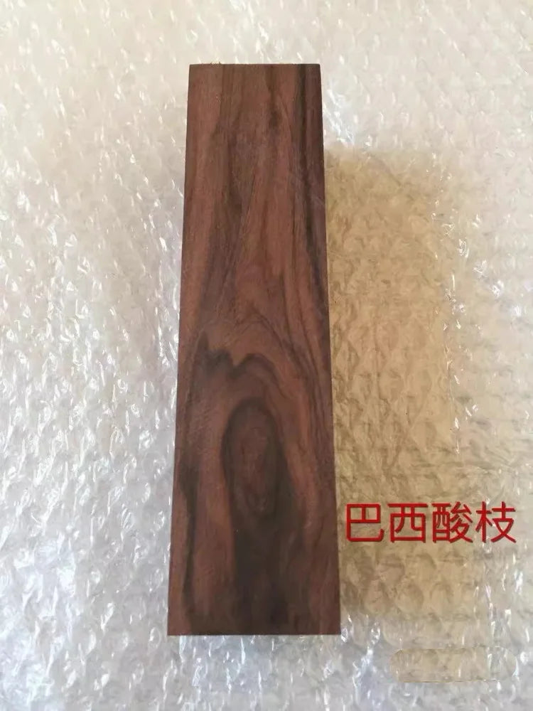 A vertical piece of dark brown wood, likely a blank for knife handles or DIY projects.