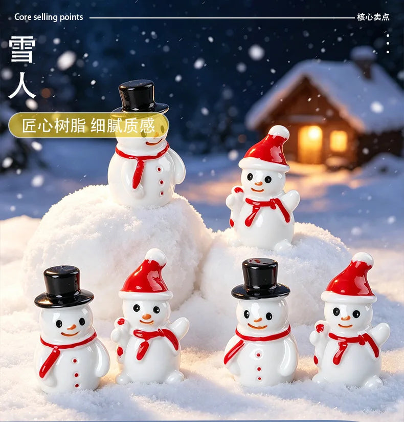 A collection of white resin snowman figurines with red hats and scarves are displayed on a snowy surface.