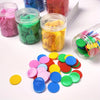 A collection of colorful plastic counting chips in various shades of pink, green, yellow, and blue are displayed in clear jar