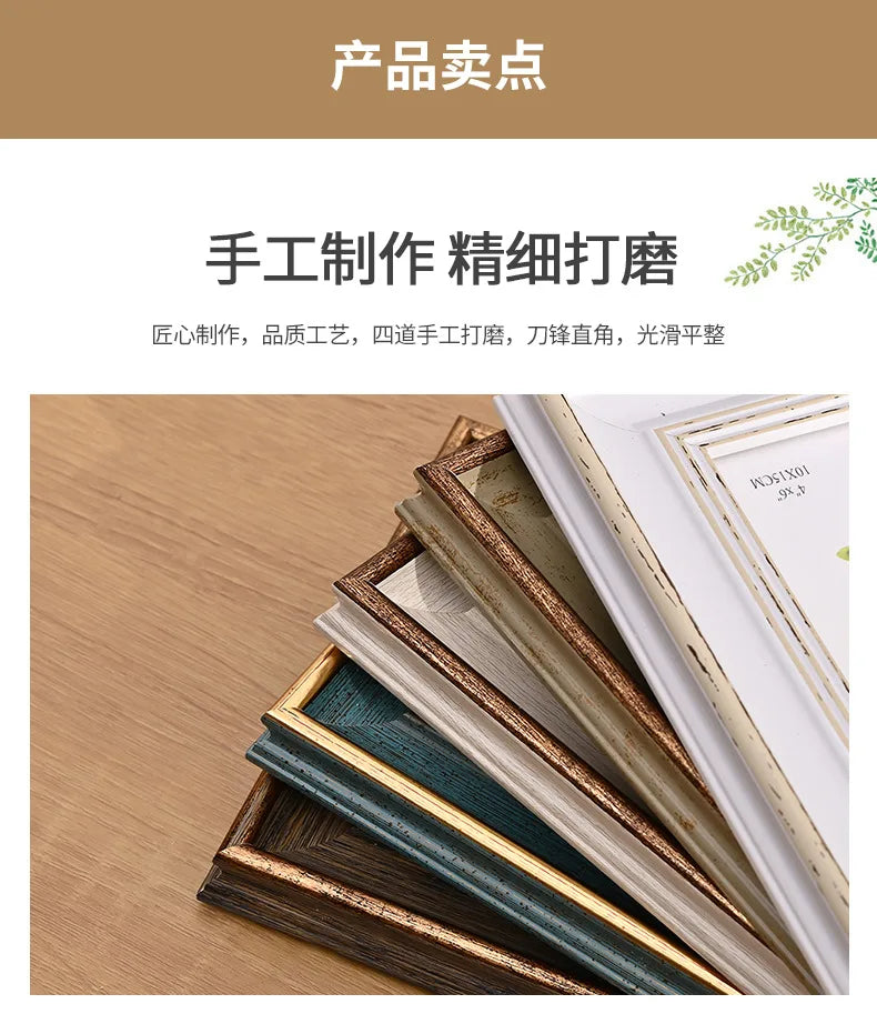 A stack of handcrafted wooden photo frames with various colors and finishes displayed on a wooden surface.