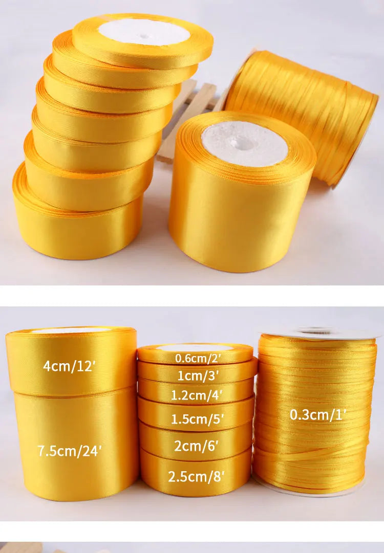 Rolls of gold yellow satin ribbon in various widths and lengths for crafts and gift wrapping