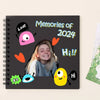 A black spiral-bound notebook featuring colorful doodles and text like Memories of 2024 and Hi!