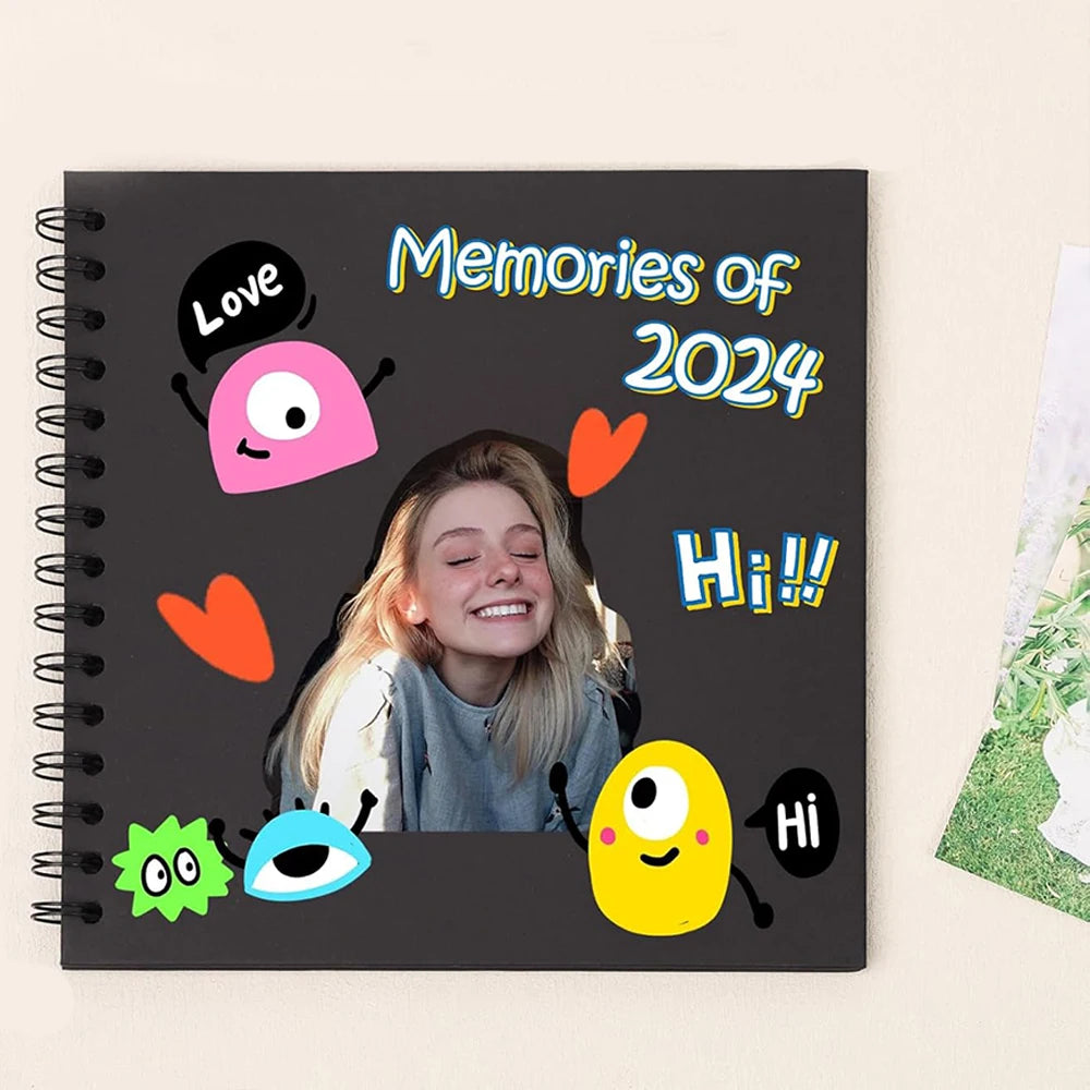 A black spiral-bound notebook featuring colorful doodles and text like Memories of 2024 and Hi!