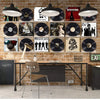A display of clear acrylic floating record shelves mounted on a brick wall with various vinyl records and lighting fixtures.