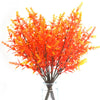 A vibrant arrangement of orange and red artificial fall eucalyptus and flower stems for outdoor decor.