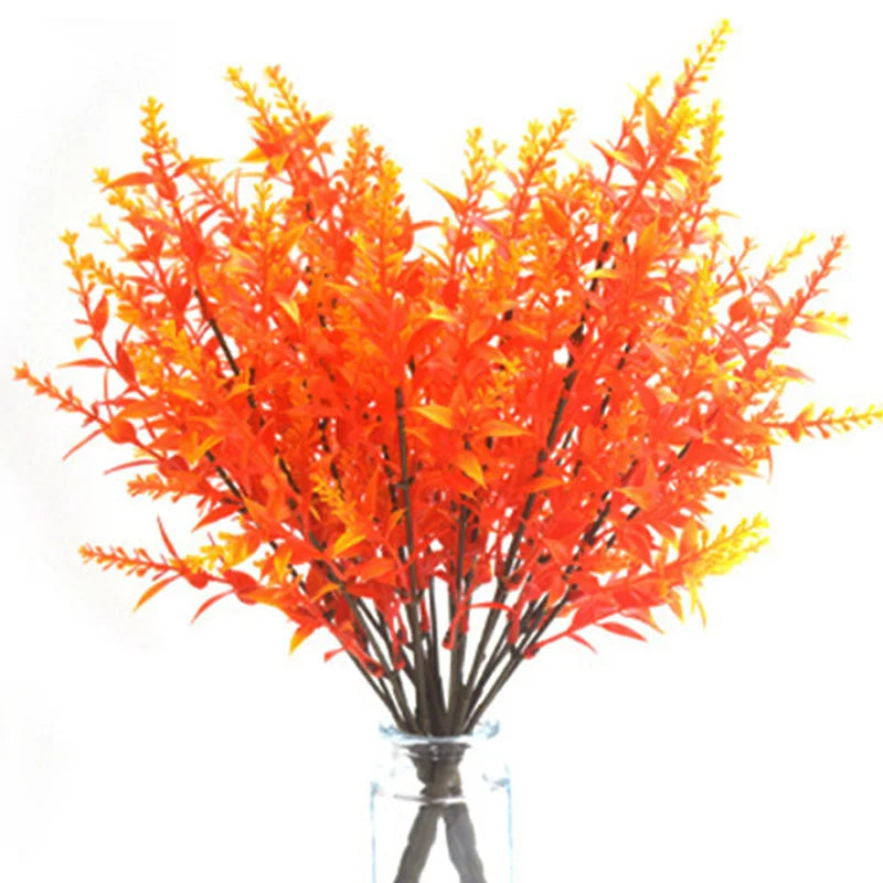 A vibrant arrangement of orange and red artificial fall eucalyptus and flower stems for outdoor decor.