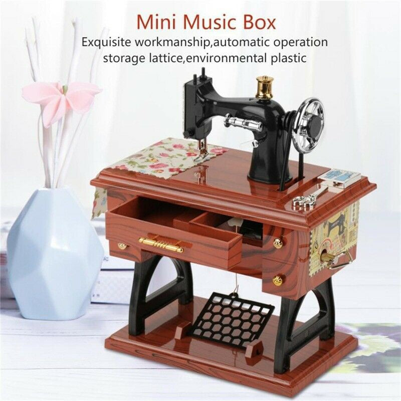 A wooden mini music box featuring a vintage sewing machine with a crank and storage lattice.