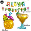 A set of Hawaiian luau party sunglasses and table mats featuring letters spelling ALOHA and a large pineapple shaped item