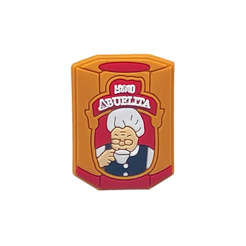 Orange and red PVC shoe charm shaped like a vintage label with the text ABUELITA