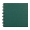A green spiral-bound notebook or scrapbook album with a dark teal cover.