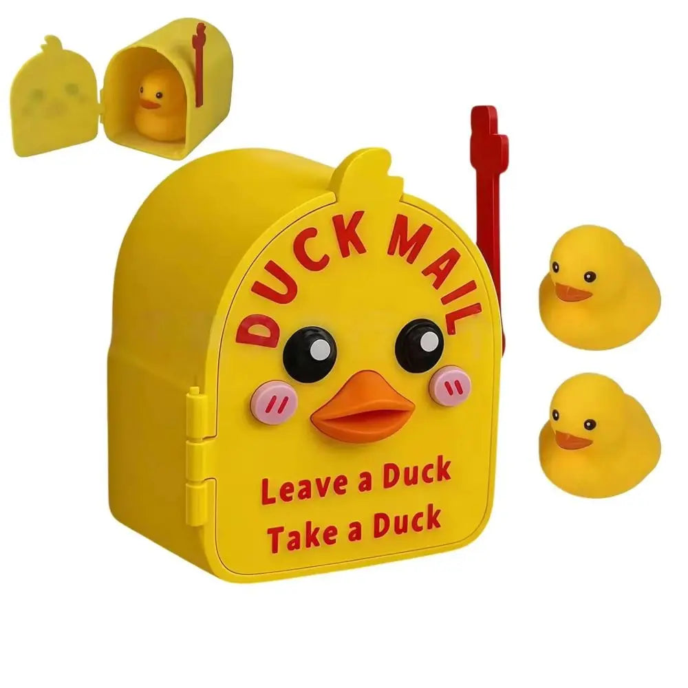 Yellow magnetic duck mailbox cover with a hidden duckling inside and an accompanying yellow duck figure.