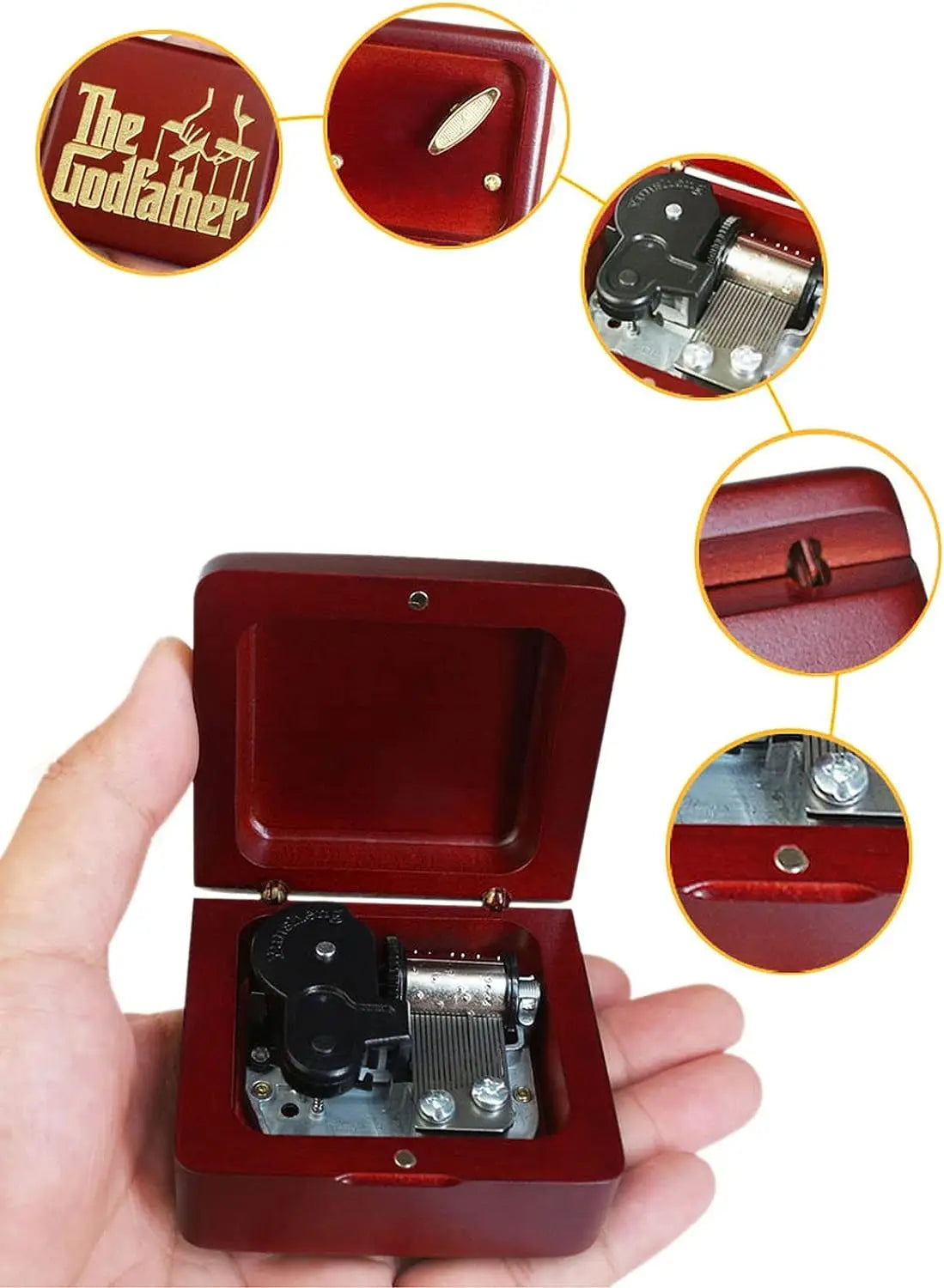 A close-up view of a red music box with an open lid, showing the internal mechanism and decorative elements.