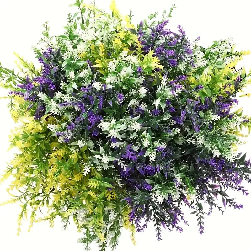 A dense bouquet of artificial lavender and green foliage with white and yellow accents for outdoor decor