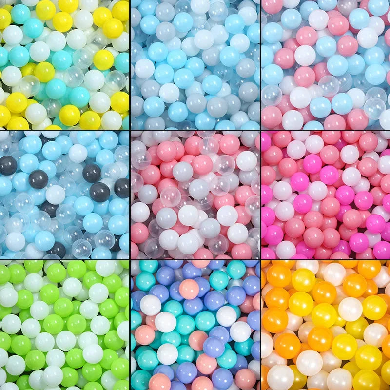 A collection of colorful, translucent plastic balls in various shades including blue, pink, yellow, and white.