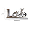 Silver resin letters spelling LOVE with a retro gold and silver foil finish
