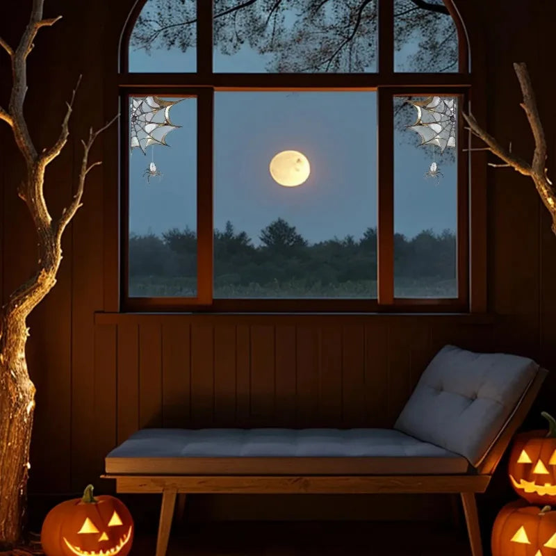 A window view at dusk showing a full moon and trees, with an orange pumpkin on the floor.