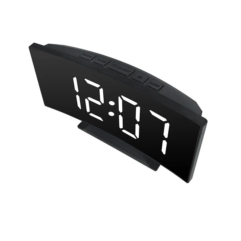 A black LED alarm clock with a digital display showing 12:07 and various function buttons.