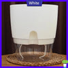 White self-watering transparent flower pot with a cotton rope visible inside.