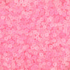 Close-up view of pink frosted glass rice beads for jewelry making
