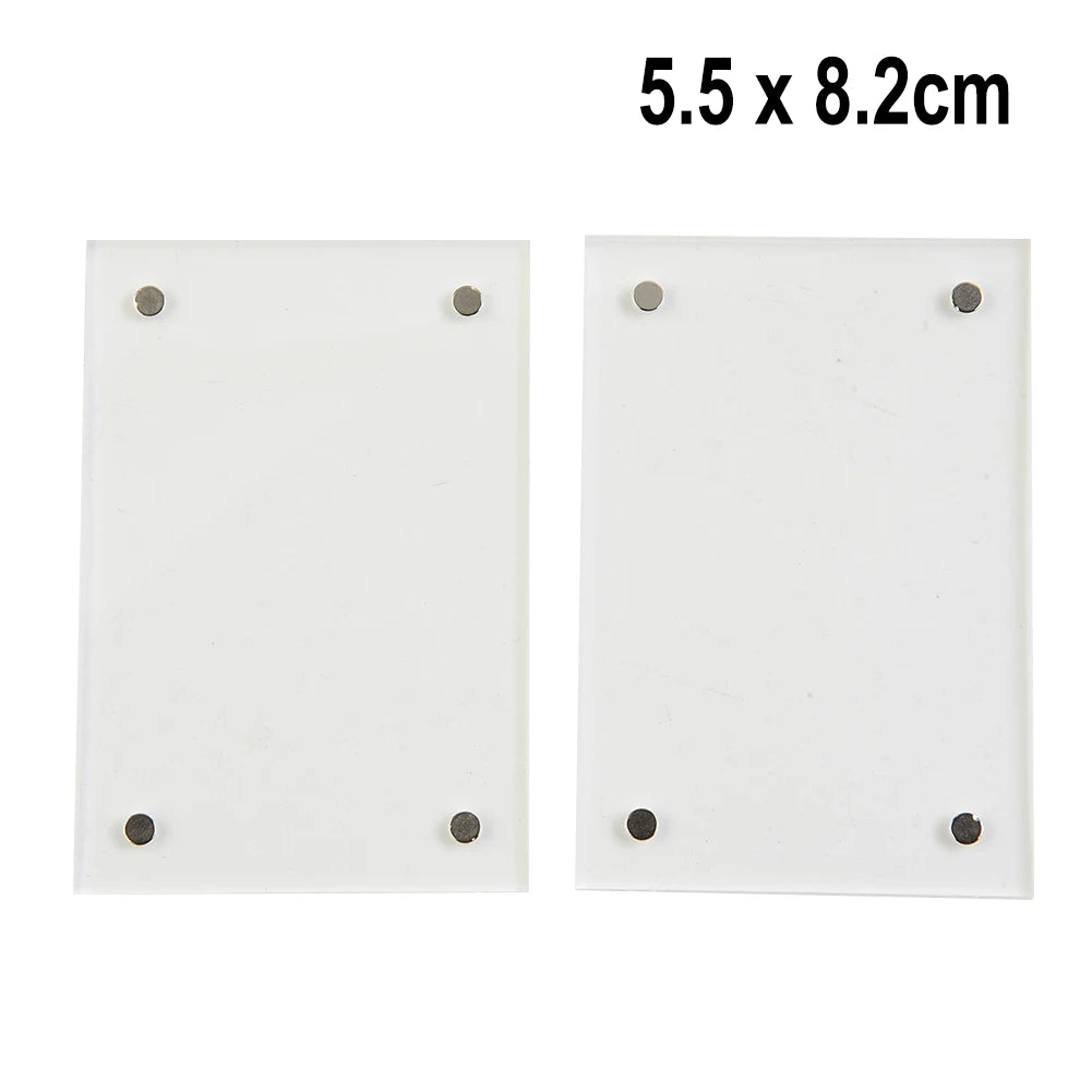 White acrylic magnetic photo frame measuring 5.5 x 8.2 cm with four mounting holes.