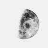 A minimalist black and white print of a moon phase on canvas wall art.