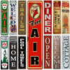 A collection of vintage funny metal street signs featuring words like Free, Diner, and Welcome.