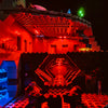 A detailed model of the Death Star with red lighting and an illuminated hexagonal interior display.