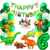 A collection of green and yellow foil balloons, a banner, and dinosaur-themed decorations for a party.