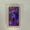 A fine copper fantasy art bar in a protective case featuring a purple-haired female figure.